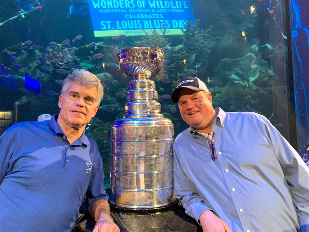 CUP ON THE RUNThe Stanley Cup is still making the rounds as the prized NHL trophy remains with the St. Louis Blues organization until the next champion is crowned at season’s end. At Bass Pro Shops, above, Blues owner Tom Stillman, left, poses with Falstaff’s Local sports bar owner Scott Morris. Organizers of the St. Louis Blues Day in Springfield on Oct. 10 estimate 5,000-6,000 people came out to public celebrations to take pictures with the Cup.